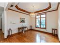 Bright living room featuring hardwood floors, custom trim, and large window for natural light at 1853 Water Oak Ct, Avon, IN 46123