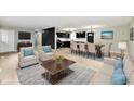 Staged living room featuring stylish furniture, an open concept, and modern design at 1965 Churchill Rd, Franklin, IN 46131