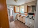 Functional kitchen equipped with white appliances and ample counter space for cooking at 2109 N Janney Ave, Muncie, IN 47304