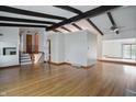 Spacious living room features hardwood floors, exposed beams, and an open floor plan at 318 Camby St, Greenwood, IN 46142