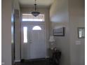 Inviting foyer with elegant lighting, neutral walls, and a classic front door design at 3504 Inverness Blvd, Carmel, IN 46032