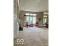 Bright living room featuring a large window with curtains and natural light at 3504 Inverness Blvd, Carmel, IN 46032