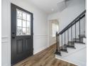 Bright foyer with hardwood floors and stairway at 4106 Armon Ct, Carmel, IN 46033