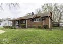 Charming brick house showcasing a well-kept lawn and traditional architecture at 438 Park Dr, Greenwood, IN 46143