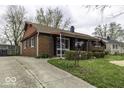 Attractive brick home with a long driveway and well-maintained landscaping at 438 Park Dr, Greenwood, IN 46143
