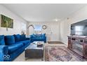 Cozy living room with bright walls, plush seating, and an eye-catching decorative rug at 4613 Walker St, Greenwood, IN 46143