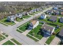 Neighborhood aerial view showcasing cozy homes and lush landscaping at 5209 Twin Bridge Blvd, Indianapolis, IN 46239