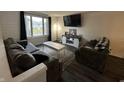 Cozy living room with modern decor, comfortable seating, and a large window for ample light at 6225 Roberts Creek Ln, Indianapolis, IN 46221