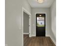 Entryway featuring new flooring, fresh paint, and updated lighting, creating a welcoming atmosphere at 715 Cottage Ave, Indianapolis, IN 46203