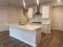 Bright kitchen with white cabinets, quartz countertops, stainless steel appliances, and a central island at 7342 Shroyer Way, Noblesville, IN 46062