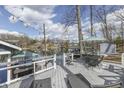 Inviting waterfront deck with lounge chairs, table, and picturesque lake view at 7668 Heather Dr, Nineveh, IN 46164