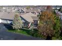 Aerial view of a residential home featuring a well-manicured lawn and mature trees at 7971 Cool Hollow Pl, Indianapolis, IN 46237