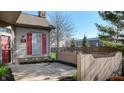 View of the side of a home featuring stone foundation and red shutters at 7971 Cool Hollow Pl, Indianapolis, IN 46237