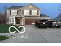 Charming two-story home with a well-maintained lawn, a two-car garage, and mature trees enhancing curb appeal at 804 Seabreeze Dr, Avon, IN 46123