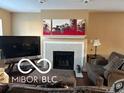 Inviting living room with a fireplace, stylish decor, and comfortable seating, perfect for relaxation and entertaining at 804 Seabreeze Dr, Avon, IN 46123