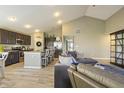 Spacious living room with modern décor, seamlessly connected to a well-equipped kitchen and dining area at 11622 Brookwood Trace Dr, Indianapolis, IN 46229