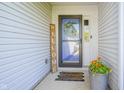 Cozy front porch with a welcome sign and decorative flower pot at 14203 Cliffwood Pl, Fishers, IN 46038