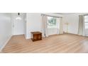 Bright living room featuring wood floors, neutral walls, and ample natural light at 217 S 17Th Ave, Beech Grove, IN 46107