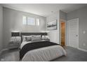 Modern bedroom featuring natural light, neutral colors, and stylish décor create a relaxing atmosphere at 2237 S Copperstone Dr, New Palestine, IN 46163