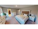 Relaxing bedroom features an ensuite bathroom, walk-in closet, and cozy carpet at 3117 Allesley Way, Westfield, IN 46074