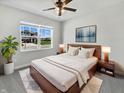Serene main bedroom featuring a large window, stylish furniture, and contemporary decor at 3278 Jasper Ln, Brownsburg, IN 46112