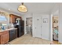 Bright kitchen adjacent to laundry and living areas at 4159 Asbury St, Indianapolis, IN 46227