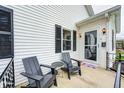 Relaxing front porch featuring outdoor seating, creating a cozy space to unwind and enjoy the view at 438 N 11Th Ave, Beech Grove, IN 46107
