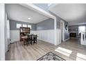 Bright dining area features wood floors, wainscoting, and elegant decor at 4644 Shelby Cir, Greenwood, IN 46143