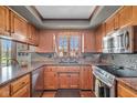 Well-lit kitchen featuring wood cabinets, stainless steel appliances, and granite countertops at 4930 Founders Ct, Anderson, IN 46017