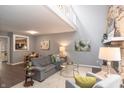 Open-concept living room with view of kitchen and stone fireplace at 5713 Bradston Way, Indianapolis, IN 46237