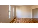 Bright, airy room with hardwood floors and natural light streaming through windows at 6967 Bluffridge Way, Indianapolis, IN 46278