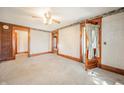 Spacious living room with wood trim and a classic ceiling fan at 10723 E State Road 234, Wilkinson, IN 46186