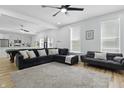 Open-concept living room with hardwood floors, ceiling fan, and comfortable seating at 1321 Union St, Indianapolis, IN 46225