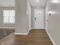 Bright entryway features hard surface flooring and a white front door at 14917 Mia Dr, Carmel, IN 46033