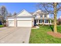 Well-maintained two-story home with a three-car garage, beautiful landscaping and brick accents at 1950 Midnight Pass, Brownsburg, IN 46112