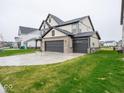 Charming two-story home with a three car garage and well-manicured lawn at 20398 N Pacific Ave, Westfield, IN 46074