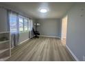 Inviting living room with new flooring, large windows, and modern lighting at 3413 Ivory Way, Indianapolis, IN 46227