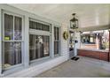 Charming front porch with decorative wreath and traditional lighting fixture at 52 N Oakland Ave, Indianapolis, IN 46201