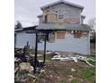 Backyard shows significant fire damage to the siding and frame of the home at 601 E Thompson St, Edinburgh, IN 46124