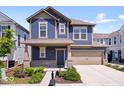 Beautiful two-story home featuring a mix of siding, a covered porch, and an attached garage at 7012 Pickett Pl, Carmel, IN 46033