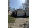 Charming single-Gathering home with a driveway and manicured lawn at 8219 Lake Tree Ln, Indianapolis, IN 46217