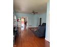 Spacious living room featuring wood floors and neutral blue walls at 8219 Lake Tree Ln, Indianapolis, IN 46217
