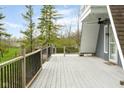 Expansive deck featuring wood railings overlooking a beautifully landscaped yard at 8394 S 600 W, Pendleton, IN 46064