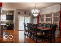 Well-lit dining room with large table and chairs, adjacent to kitchen at 10105 Yosemite Ln, Indianapolis, IN 46234