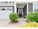 Welcoming front entrance with charming landscaping, stylish accents, and a covered entryway at 10319 Pronghorn Ln, Indianapolis, IN 46239