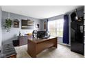 Comfortable home office with a large desk, ample storage, and natural light at 10955 Balfour Dr, Noblesville, IN 46060