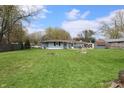 Expansive backyard with lush green grass, offering ample space for outdoor activities and relaxation at 1255 Easy St, Greenwood, IN 46142
