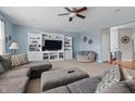 Spacious living room with a large sectional sofa, built-in entertainment center, and neutral decor at 1575 Oakvista Dr, Greenwood, IN 46143