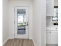 Bright entry with a glass-paneled door and view of the adjacent kitchen and backyard at 18037 Promise Rd, Noblesville, IN 46060