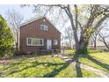 Traditional brick two-story home with mature trees, lawn, and a welcoming front entrance at 2741 Mars Hill St, Indianapolis, IN 46241